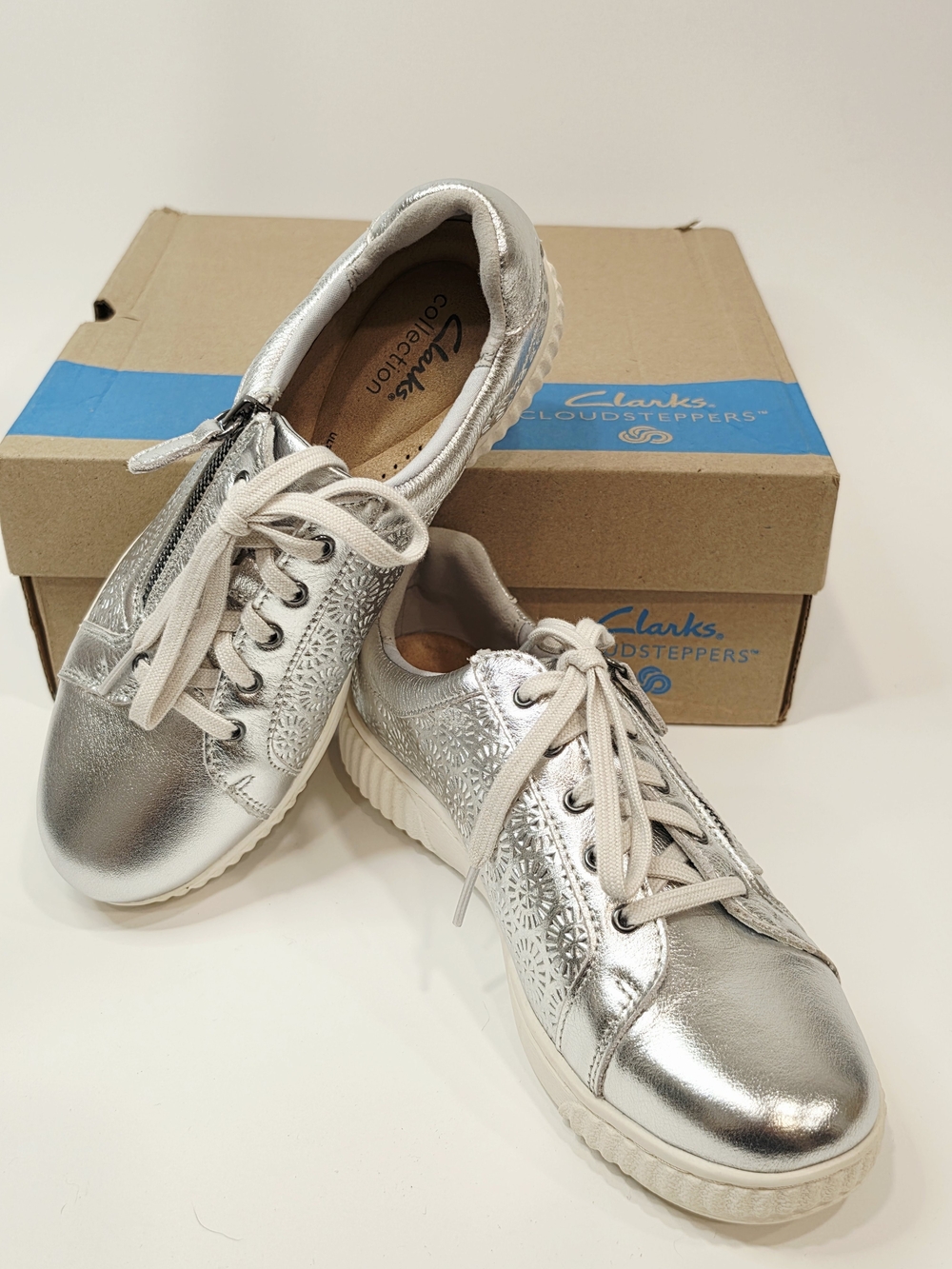 Clarks Collection Caroline Rio leather sneakers in a silver metallic finish